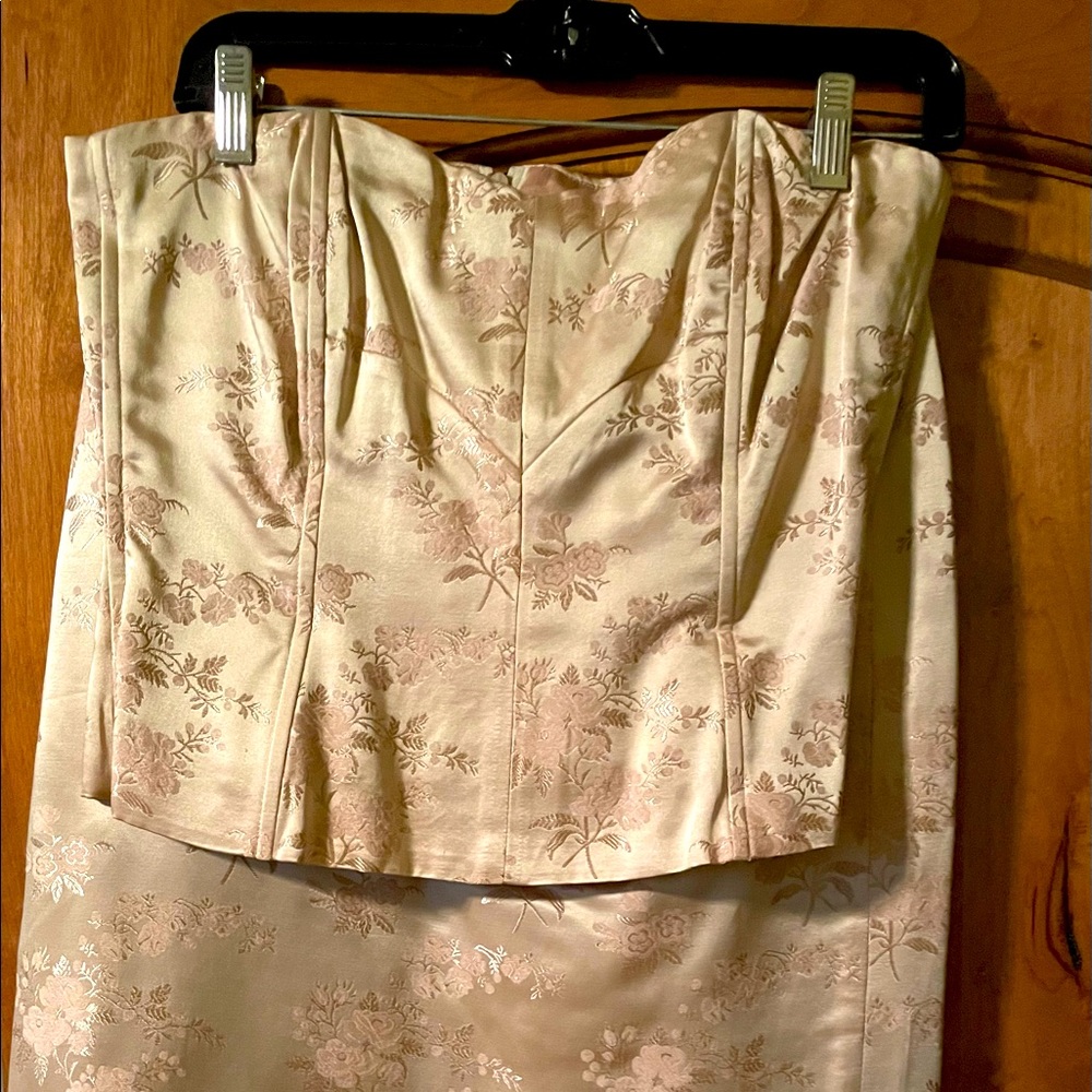 Champagne colored boustier top and skirt with raw edge